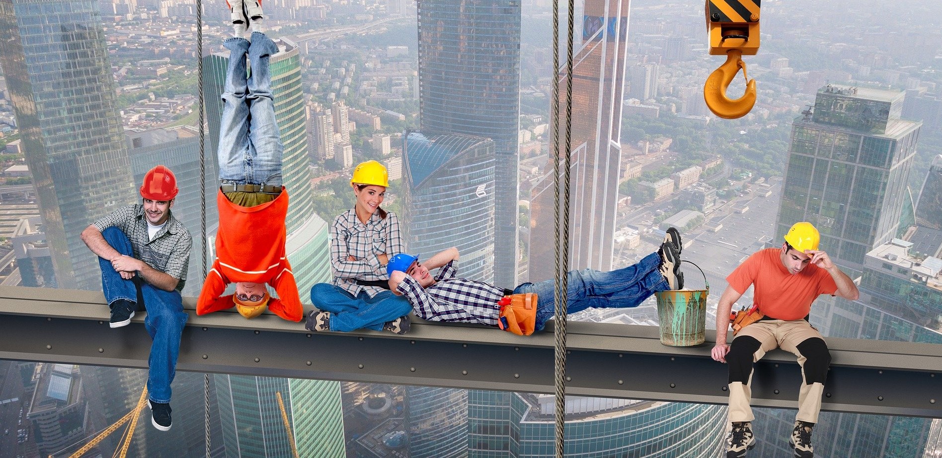 skyworkers sitting on a scaffold