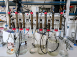 Sand columns mimicking bank filtration systems. Four sets of such systems are shown, with each set containing two columns, connected by either an oxygen-supplying or an oxygen-depleting short column.