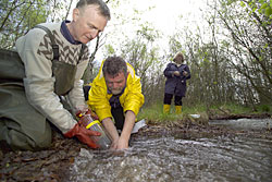 Scientist taking gas samples from the mofette