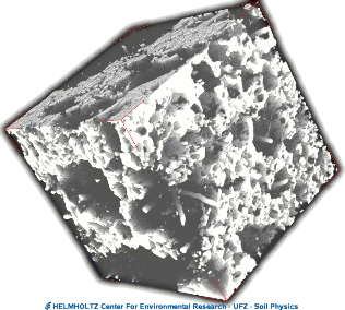 ... and the visualized inter-aggregate pore space within an inscribed cube - the living space of soil meso-fauna, supply paths of oxygen and location of fast flow and transport processes.